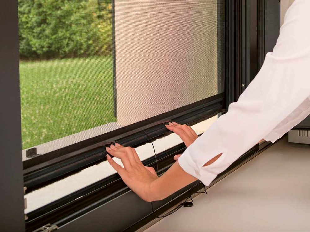 Roller mosquito net on a window